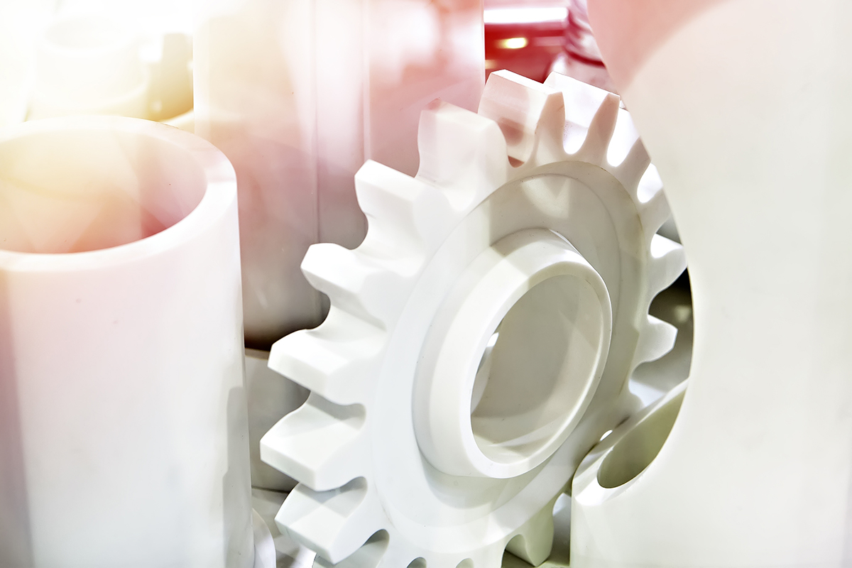 Machined white plastic gears and rods